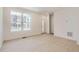 Bright open-concept living area with laminate floors, white walls, recessed lighting, and a view of the home's exterior at 2006 S Haleyville Way, Aurora, CO 80018