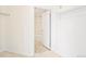View of a bathroom through a doorway, featuring a bathtub and tiled walls at 300 W 11Th Ave # 6G, Denver, CO 80204
