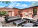Charming outdoor space with a built-in grill area, comfortable seating, and ample room for entertaining, set against a brick exterior at 2153 S Columbine St, Denver, CO 80210