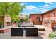 Outdoor living space with patio, fireplace, grill, and comfortable seating arrangement at 2153 S Columbine St, Denver, CO 80210
