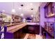 Stylish bar area with marble countertops, custom cabinets, wine storage, and colorful lighting at 2153 S Columbine St, Denver, CO 80210