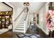 Spacious foyer with hardwood floors, staircase, and decorative accents at 2153 S Columbine St, Denver, CO 80210