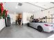 Organized garage with epoxy floor, a convertible car, and storage solutions at 2153 S Columbine St, Denver, CO 80210