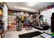 Spacious home gym with workout equipment and walls lined with album covers at 2153 S Columbine St, Denver, CO 80210