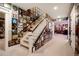 Hallway featuring walls covered with album covers, carpeted stairs, and ample lighting at 2153 S Columbine St, Denver, CO 80210