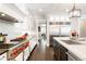 Gourmet kitchen boasts high-end appliances, custom cabinetry, and a seamless flow to adjacent dining areas at 2153 S Columbine St, Denver, CO 80210
