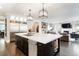 Well-appointed kitchen with a large island, stainless steel refrigerator, and an open layout for easy entertaining at 2153 S Columbine St, Denver, CO 80210