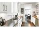 Well-lit kitchen showcases sleek countertops, modern appliances, and seamless transition to the dining area at 2153 S Columbine St, Denver, CO 80210