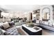 Spacious living room with stylish furniture, modern decor, and an open layout into the kitchen at 2153 S Columbine St, Denver, CO 80210