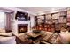 Cozy living room with a fireplace, TV, and shelves filled with vinyl records at 2153 S Columbine St, Denver, CO 80210