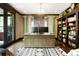 Stylish home office featuring custom built-ins, decorative pillars, and ample workspace at 2153 S Columbine St, Denver, CO 80210