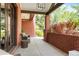 Covered porch with comfortable seating, brick columns, and scenic outdoor views at 2153 S Columbine St, Denver, CO 80210