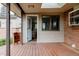 Cozy back porch with wood flooring, showing an open door to the interior at 1475 S Urban Way, Lakewood, CO 80228
