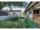 Charming backyard featuring lush landscaping, a well-maintained lawn, and a detached garage at 1475 S Urban Way, Lakewood, CO 80228