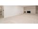 Large basement area with neutral carpet, fireplace, and bright white walls at 1475 S Urban Way, Lakewood, CO 80228