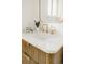 Bathroom vanity with marble top, gold faucet and natural wood cabinet at 1475 S Urban Way, Lakewood, CO 80228