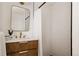 Elegant bathroom with a modern vanity, gold fixtures, and a beautifully tiled shower at 1475 S Urban Way, Lakewood, CO 80228