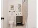Modern bathroom with a vanity, patterned tiling, brushed gold fixtures, a bathtub and tiled shower at 1475 S Urban Way, Lakewood, CO 80228