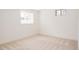 Bright bedroom showcasing natural light and neutral carpeting at 1475 S Urban Way, Lakewood, CO 80228