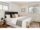 Bright bedroom featuring a well-made bed, stylish rug, and an abundance of natural light at 1475 S Urban Way, Lakewood, CO 80228