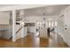 Open-concept dining area with hardwood floors, modern lighting, and seamless access to the kitchen at 1475 S Urban Way, Lakewood, CO 80228
