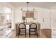 Bright dining area with stylish table and chairs, modern lighting, and easy access to other living spaces at 1475 S Urban Way, Lakewood, CO 80228