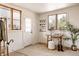 Welcoming entryway with natural light, stylish decor, a wooden table, and a cozy atmosphere for guests at 1475 S Urban Way, Lakewood, CO 80228