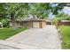 Ranch style home featuring a brick exterior, driveway, lawn and 2 car garage at 1475 S Urban Way, Lakewood, CO 80228