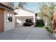 Spacious detached garage showcasing a vintage car, with extra storage space and access from the driveway at 1475 S Urban Way, Lakewood, CO 80228