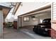 Spacious garage featuring a classic car, ample storage, and a well-lit interior at 1475 S Urban Way, Lakewood, CO 80228