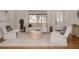 Bright living room with contemporary furniture and a large window with beautiful outside views at 1475 S Urban Way, Lakewood, CO 80228
