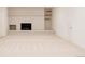 Bright living room with a white brick fireplace, mantle, and neutral carpeting throughout at 1475 S Urban Way, Lakewood, CO 80228