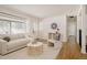 This is a bright living room with wood and carpet flooring with modern furniture at 1475 S Urban Way, Lakewood, CO 80228