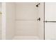 Sleek shower with stylish tile and modern black fixtures at 1475 S Urban Way, Lakewood, CO 80228