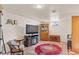 View of finished basement area with furniture, television, and antique furnishings at 1275 Otis St, Lakewood, CO 80214