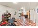 View of a finished basement area with checkered floors and furniture at 1275 Otis St, Lakewood, CO 80214