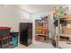 Basement storage area featuring shelving and storage containers at 1275 Otis St, Lakewood, CO 80214
