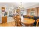 Eat in kitchen area with wooden table and chairs, and open shelving at 1275 Otis St, Lakewood, CO 80214