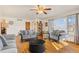 Spacious living room with hardwood floors, cozy seating, and large windows for ample natural light at 1275 Otis St, Lakewood, CO 80214