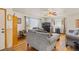 Cozy living room with hardwood floors, a ceiling fan, and ample natural light at 1275 Otis St, Lakewood, CO 80214