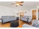 Bright living room with hardwood floors, offering a comfortable seating arrangement at 1275 Otis St, Lakewood, CO 80214