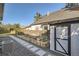 Backyard with a shed, garden boxes and stone paver walkway at 1749 S Lincoln St, Denver, CO 80210