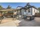 Inviting backyard with covered patio, outdoor seating, and relaxing hot tub, perfect for entertaining at 1749 S Lincoln St, Denver, CO 80210