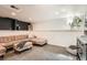 Cozy finished basement area with comfortable seating and ample space at 1749 S Lincoln St, Denver, CO 80210