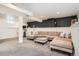 Spacious finished basement area with cozy seating and a versatile layout at 1749 S Lincoln St, Denver, CO 80210