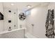 Modern bathroom featuring herringbone tile in shower and contemporary fixtures at 1749 S Lincoln St, Denver, CO 80210