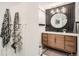 Beautiful bathroom boasting a wood vanity, sleek black accents, and modern mirror at 1749 S Lincoln St, Denver, CO 80210