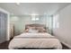 Cozy bedroom featuring wainscotting and neutral tones, creating a serene atmosphere at 1749 S Lincoln St, Denver, CO 80210