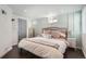 Inviting bedroom showcasing wainscotting and soft lighting, enhancing the room's charm at 1749 S Lincoln St, Denver, CO 80210