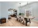Elegant dining room featuring hardwood floors and stylish decor, connected to living room at 1749 S Lincoln St, Denver, CO 80210